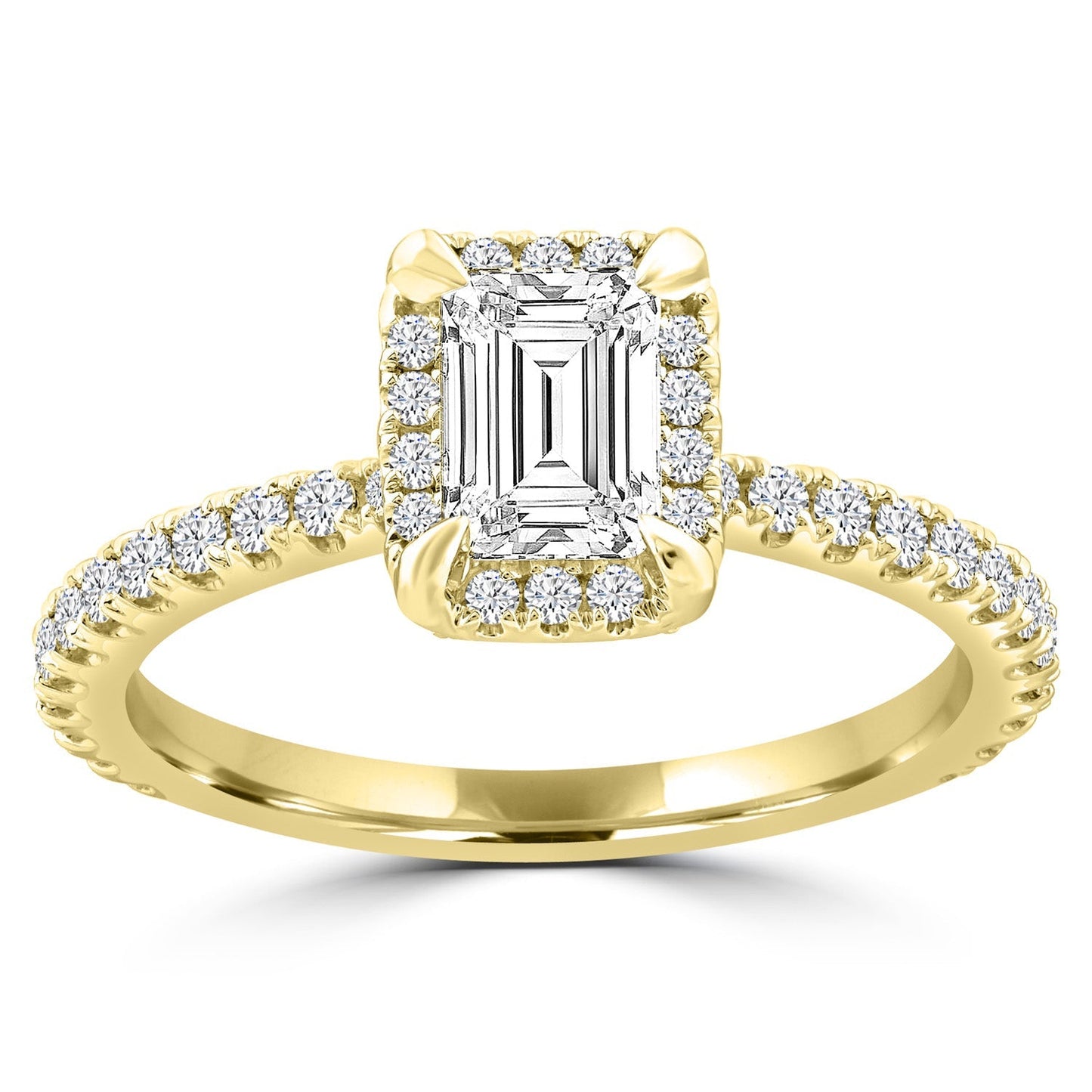 Emerald cut diamond halo ring set in yellow gold with shoulder stones