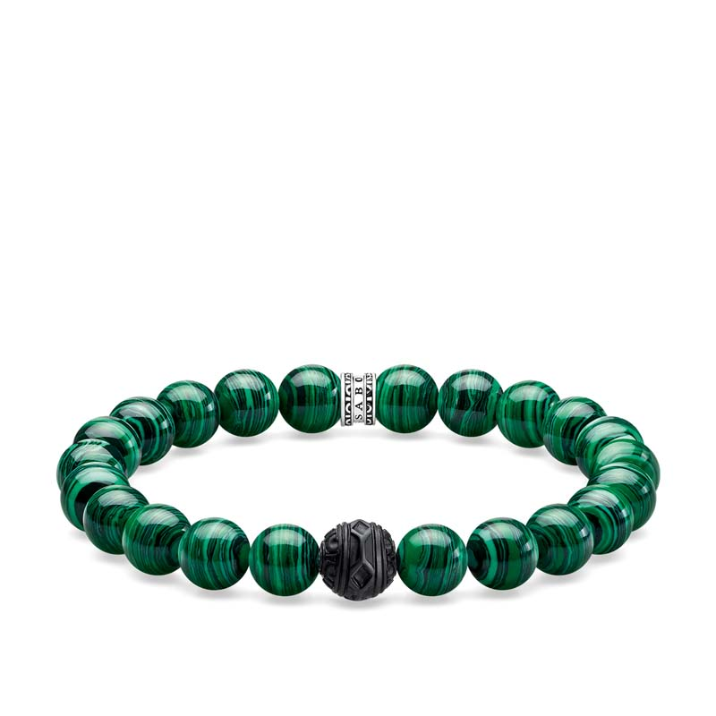 Green beaded bracelet with a black and silver clasp on a white background