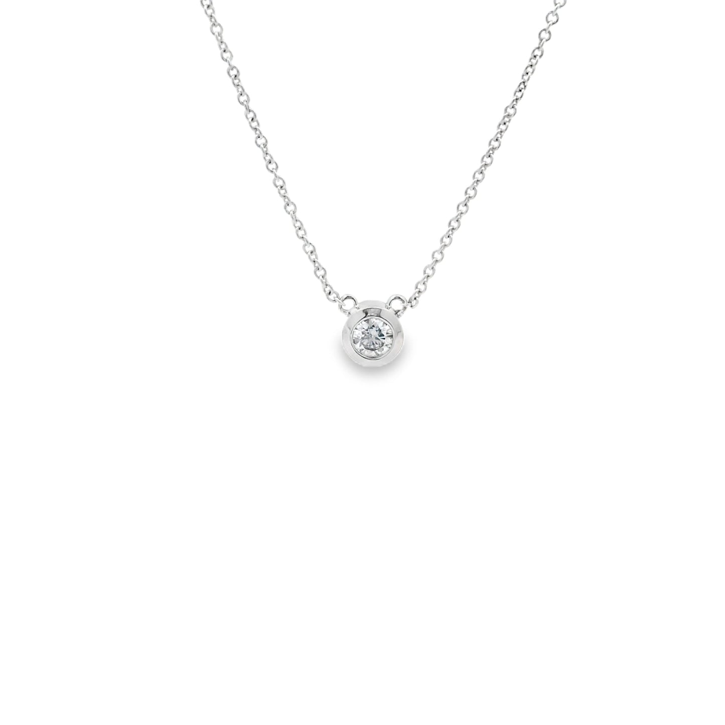 minimalistic diamond solitaire necklace in white gold bezel setting