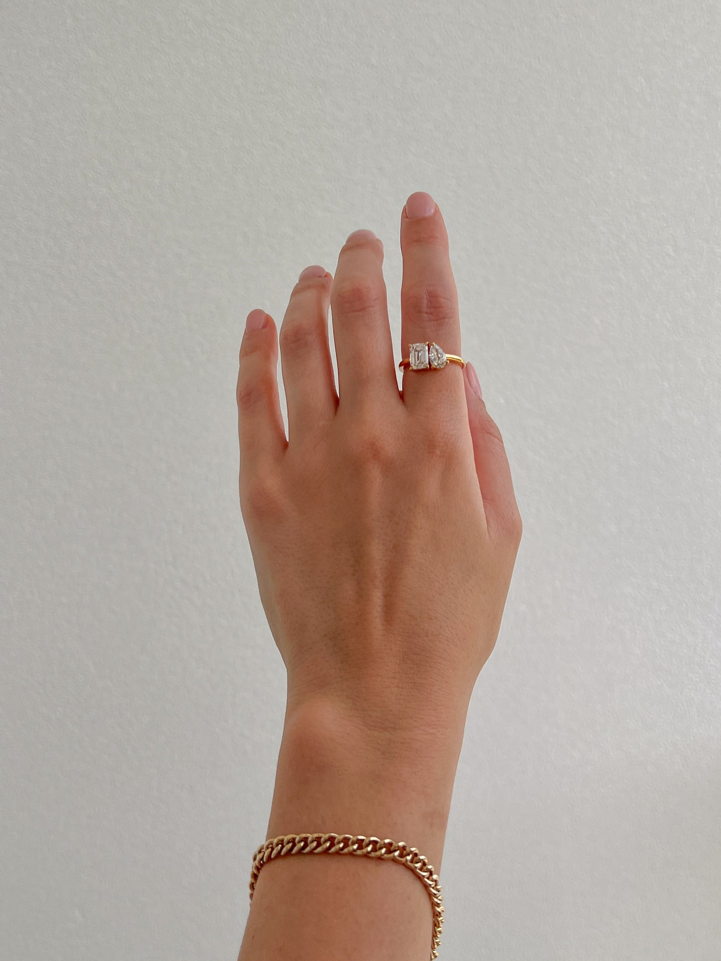 toi et moi engagement ring set in yellow gold with gold bracelet