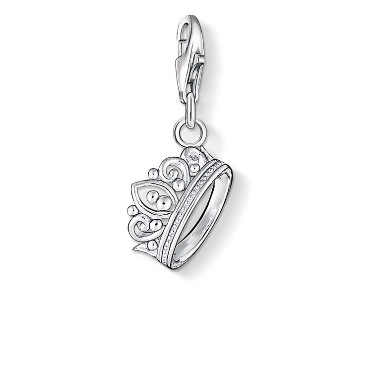 Silver charm with a crown design on a white background