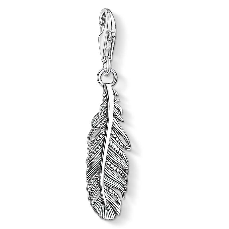 Silver feather pendant charm on a white background