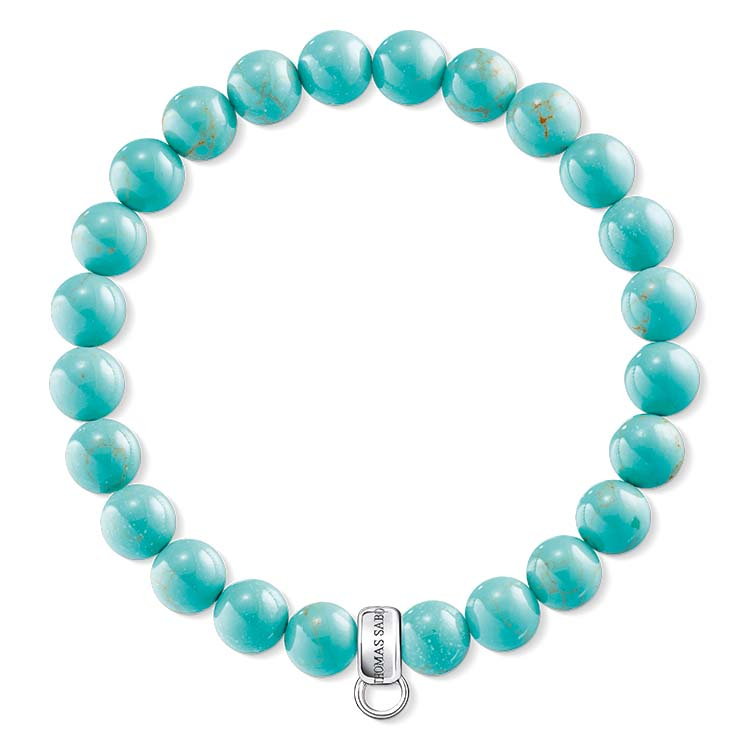 Turquoise beaded bracelet with a silver clasp on a white background