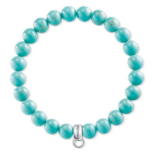 Turquoise beaded bracelet with a silver clasp on a white background