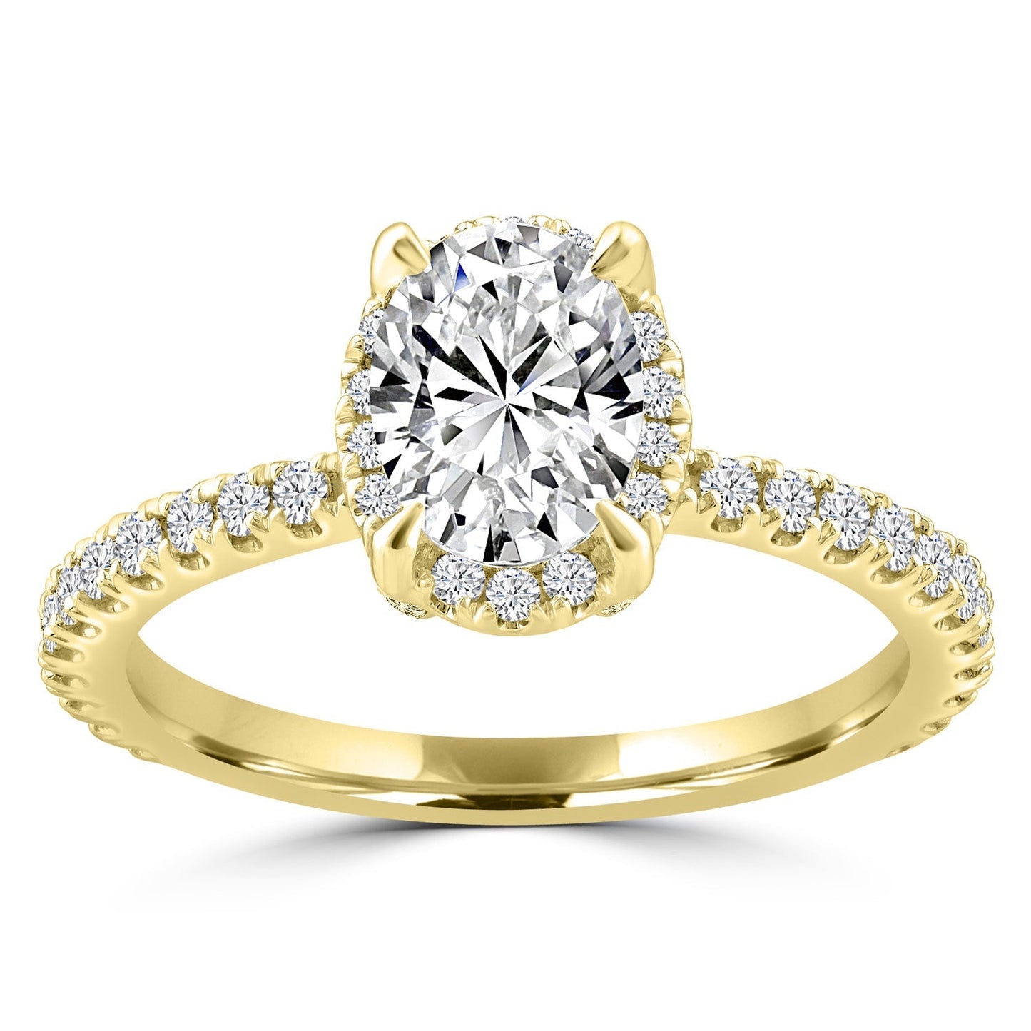 Oval diamond halo engagement ring set in yellow gold with shoulder stones