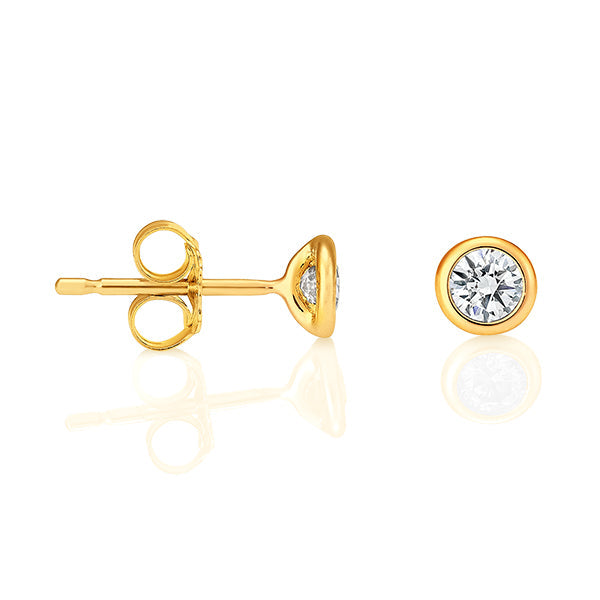bezel set diamond studs yellow gold