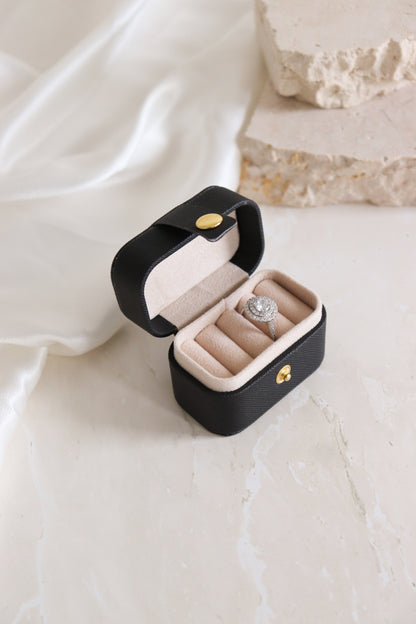 black mini travel ringbox with ring