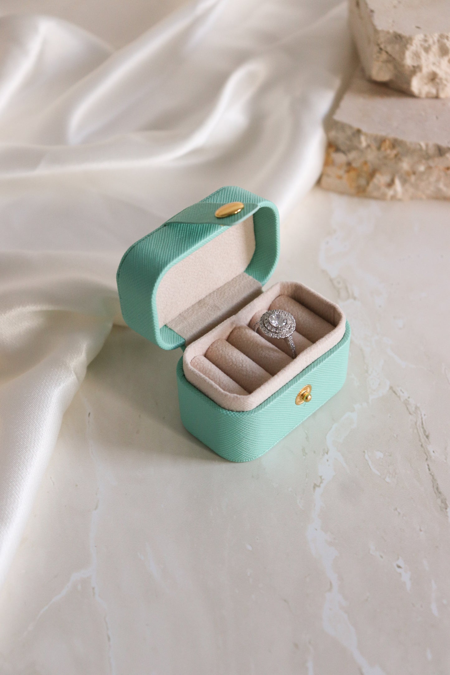blue mini travel ring box with ring