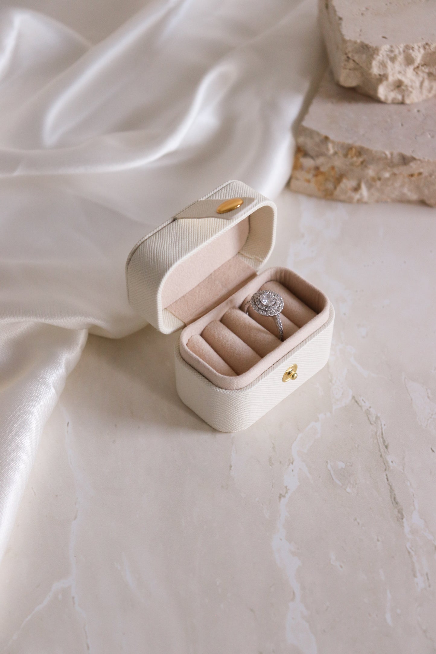 cream mini travel ring box with ring