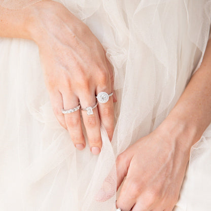 diamond rings on ladies hand tule skirt backdrop