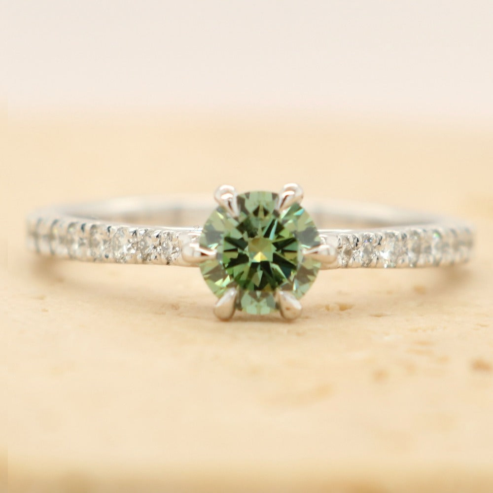 green diamond ring with 6 claws