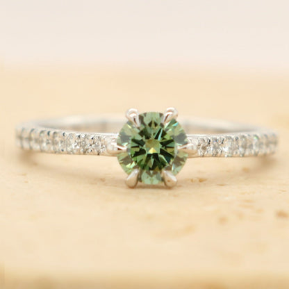 green diamond ring with 6 claws