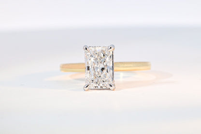hidden halo radiant cut engagement ring yellow gold band