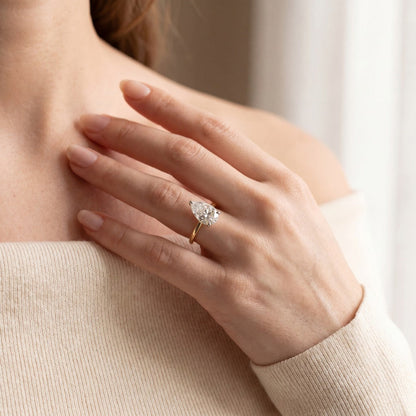 pear cut yellow gold engagement ring 