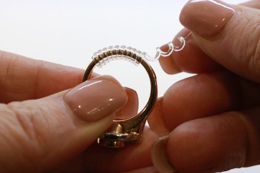 ring spiral being put on ring