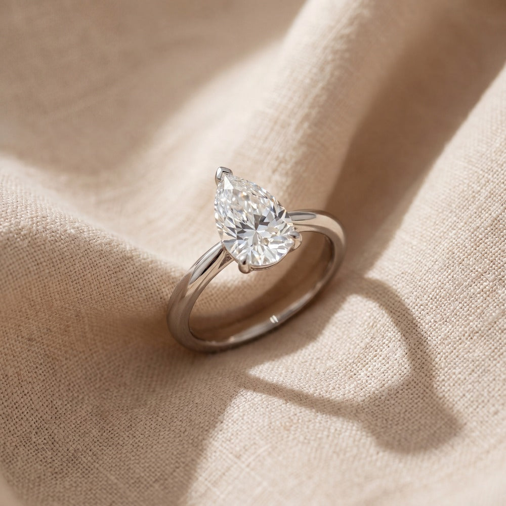 white gold engagement ring with pear shape diamond