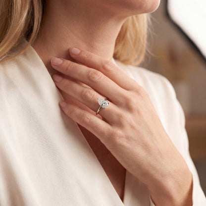 white gold engagement ring with pear shape diamond on hand
